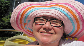 new hat on the open topped bus