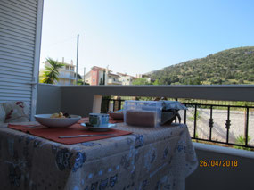 Breakfast on balcony, goat herder in hills above