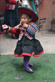 Little girl at the weaving factory