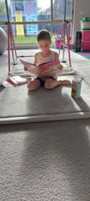 Reading her new birthday book
