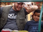Mayer with one a little boy at Planeterra project