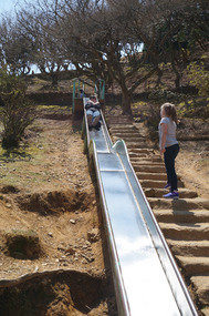 Charlotte comes rocketing down the slide