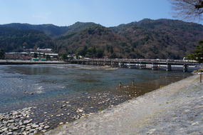 The crowd gathers on the bridge at Arashiyama