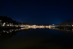 The illuminated bridge, with the alps just visible