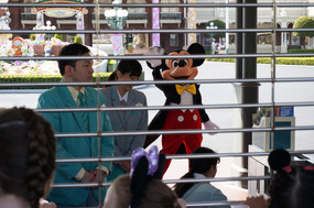 Mickey behind a fence away from the dirty visitors