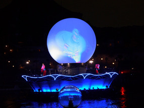 Several projection balloon floats appear
