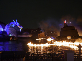 The dragon sets fire to the water around Mickey