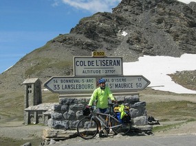 Sign and cyclist at the top
