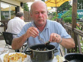 John enjoying mussels