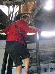 Chris climbing the wind pump
