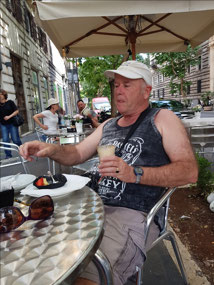 John enjoying coffee and pastries