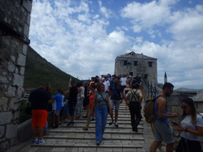 Braving the crowds to cross the bridge