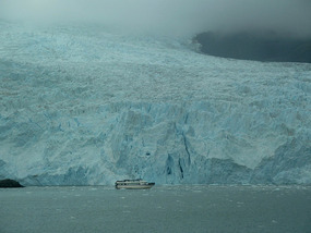 200-seater boat dwarfed by glacier