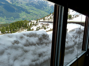 Snow piled against the gallerie