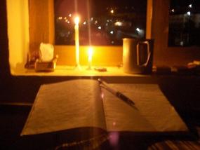 Writing by candlelight.