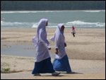muslam woman at the beach (its 95 degrees ou