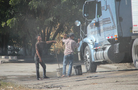 More trucks being washed