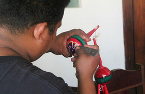 Alan carving the maracas