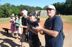 Clapping to demonstrate how sound travels clearly