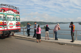 What are these people looking at from bridge top? 
