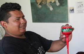 Alan carving the maracas