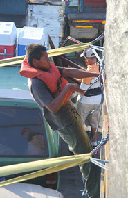 Crewmen unlashing vehicles