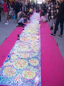 Kids painting a banner