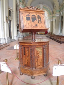 An amazing inlaid wood lecturn in a church