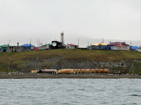 Satellite Dishes and Fuel Storage Drums