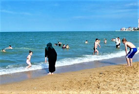 A Little Girl Ecstatic in the Sea
