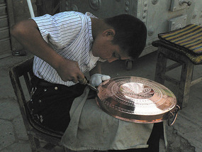 Young Boy Engraving Copperware
