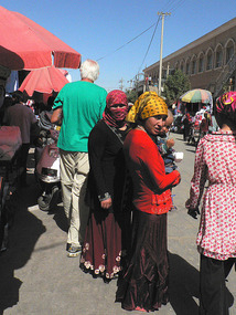 Tall Alan Behind Local People, Hotan Bazaar