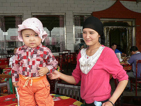 Young Uighur Woman with Her Child, Xortanglik
