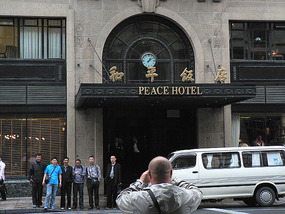 Tour Group Poses Outside the New Peace Hotel