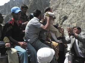 Child Being Hoisted up to the Boat Cabin