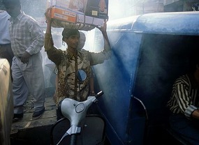 Porter Weaves Through Crowded Market, Delhi*