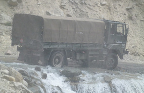 Army Truck Crosses Treacherous Wash Away