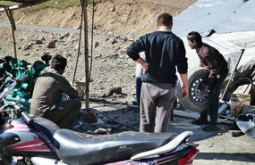 Mr Tashi Gets Our Tyre Sort of Fixed at Patseo