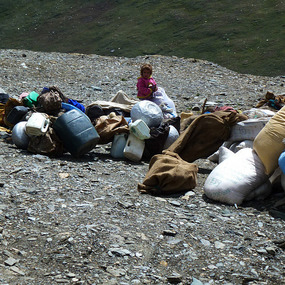 Young Nomad Girl with Family Belongings