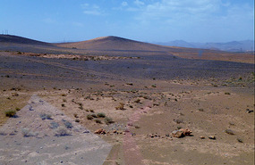 Gravel On the Desert Sands Reflects Brilliant Blue