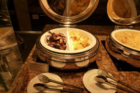 Grilled Fish and Corn at the Buffet Breakfast