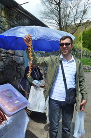 David Holding a Stick of Churchkela