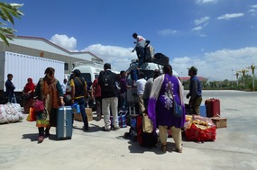 First Passengers Onto the Mini Buses to Pakistan