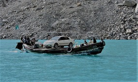 A Car is Ferried Across the Lake (c. Jonny Bealby)