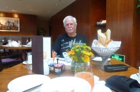 Alan Thoroughly Enjoying a Sofitel Breakfast