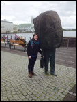 Pixie standing with a statue