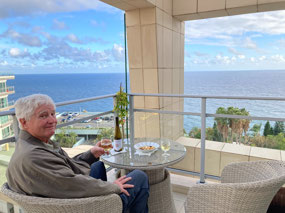 On the balcony, wine, weather and a view