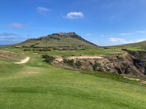 The green in middle distance, 25 mph wind in face