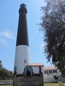 Navy blue and white brick lighthouse structure