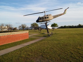Huey helicopter suspended by Viet Nam Memorial